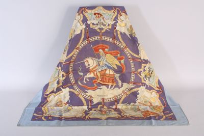 a purple and blue blanket with a picture of a man riding a horse