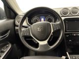 the interior of a car with a steering wheel and dashboard controls
