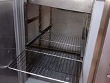 an open refrigerator that is sitting in a kitchen