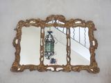 a mirror that is hanging on the wall in the room