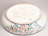 a white bowl with a floral design on it