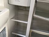 an open refrigerator with a lot of food inside of it