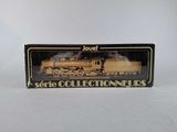 an image of a toy train set in a box on a white surface