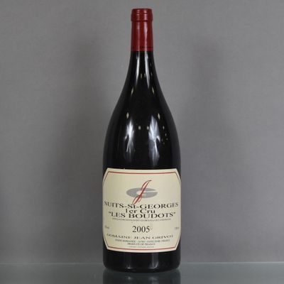 a bottle of wine that is sitting on a table