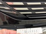a person holding a ruler in front of a car
