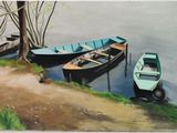 two boats that are sitting on the shore of the water