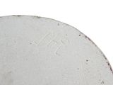 a close up of a white plate with writing on it