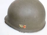 a close up of a helmet on a white surface