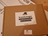a cardboard box with a sticker on it sitting on the floor