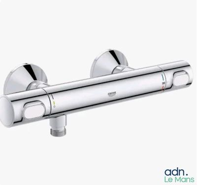 a close up of a chrome shower faucet on a white background