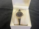 an image of a watch in a box on a table