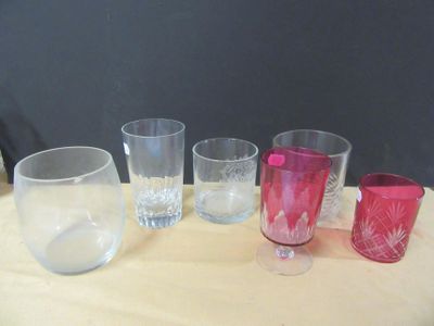 five glasses sitting on a table next to each other