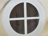 a picture of a round window on a wall