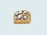 an image of a gold and diamond ring on a blue background