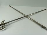 two swords on a white table with a white background