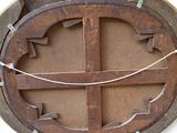 a picture of a wooden circular object with a rope