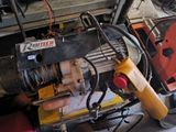 a machine that is sitting on a table in a garage