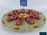 a display of a lot of toy cars on a plate