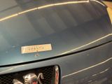 a close up of a car with a shiny emblem on it