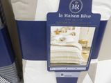 a picture of a blue and white bed set on display