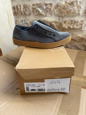 a box with a pair of shoes on top of it