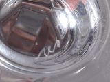 a close up of a glass of water with a cell phone in it