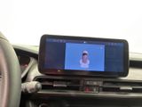 a picture of a car dashboard with a cell phone in it