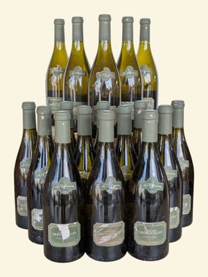 bottles of wine are lined up in a row on a white background