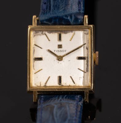 an image of a close up of a wrist watch with a blue strap