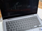 a laptop computer sitting on top of a table