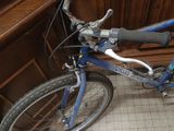 a blue bicycle that is sitting on the floor
