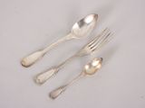 three silver spoons and two silver spoons on a white surface