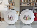 two plates that are sitting on a table