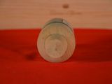 a close up of a wooden object on a red cloth