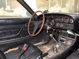 a dashboard and steering wheel of a car in a car showroom