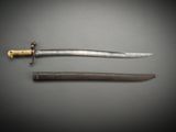 an image of a knife and a sword on a gray surface