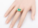 an image of a woman ' s hand with a ring on it