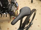 a close up of a bicycle with a saddle in a store