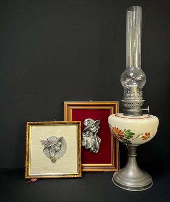 a lamp that is sitting next to a picture and a picture frame