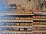 many shelves in the store that have various items on them