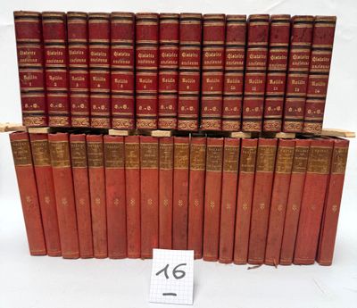 the books are lined up in rows on a white surface