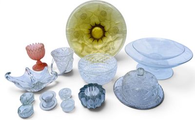 a lot of glass items that are sitting on a table