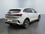 the rear end of a white suv parked in a room