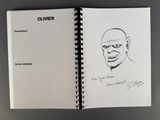 an open notebook with a drawing of a man ' s face on it