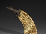 an image of a carved horn with carvings on it ' s side