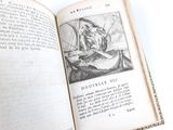 an open book with a picture of a man on a boat