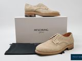 a close up of a pair of shoes on a box
