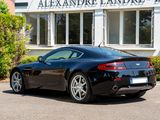 a black sports car parked in front of a building
