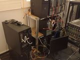 a lot of computer equipment that are sitting on the floor