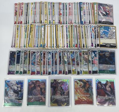 a large collection of pokemon trading cards are displayed on a table